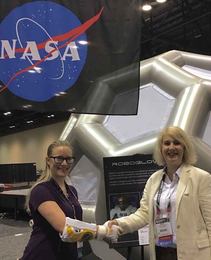 Shaking hands with NASA’s Emily McBryan and Robo-Glove. © Marie O’Mahony